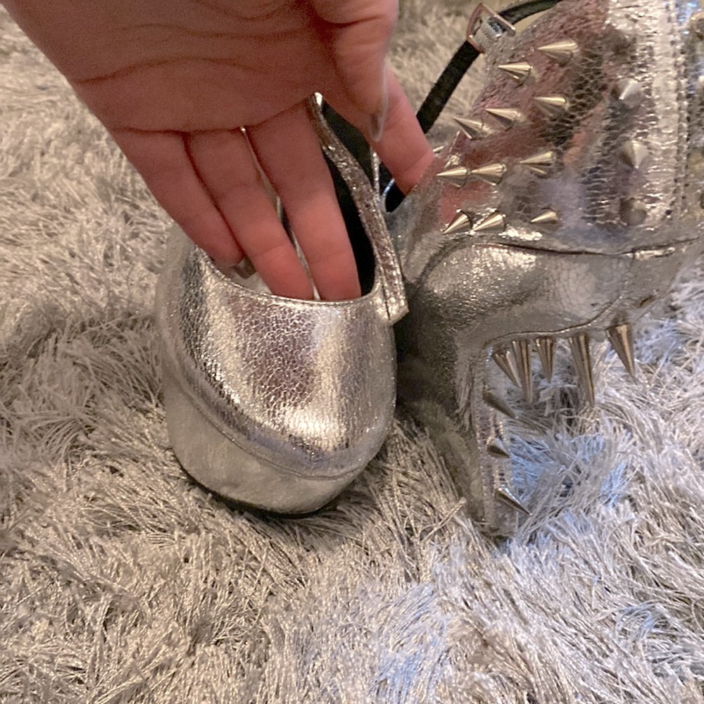 Used silver spiked go Jane size 10 heeless high heels